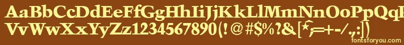 TroubadourXboldRegular-fontti – keltaiset fontit ruskealla taustalla
