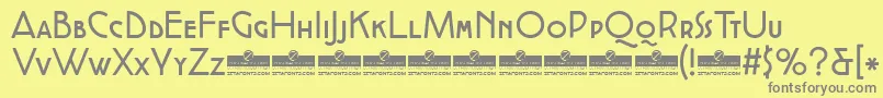 CocottealternateRegularTrial-fontti – harmaat kirjasimet keltaisella taustalla