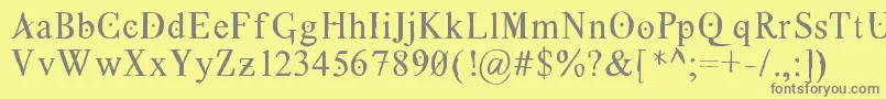 Grecoromanlubedwrestling-Schriftart – Graue Schriften auf gelbem Hintergrund