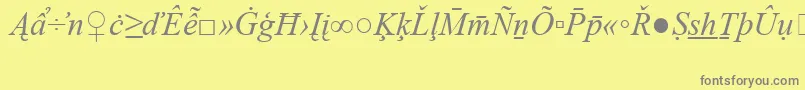 Czcionka TimesNewRomanSpecialG2Italic – szare czcionki na żółtym tle
