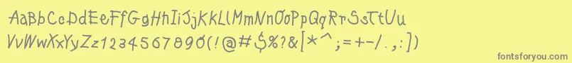 フォントKleinskrempeltypes – 黄色の背景に灰色の文字