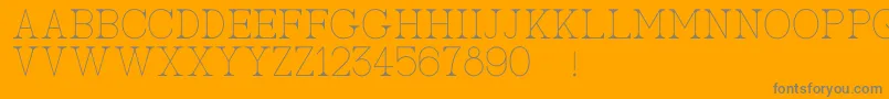 AcBigserifOne-Schriftart – Graue Schriften auf orangefarbenem Hintergrund