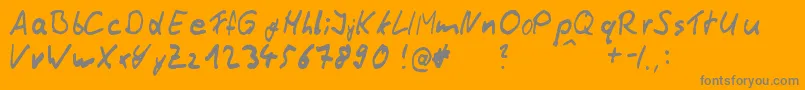 Fonte ThommyHandwrite – fontes cinzas em um fundo laranja