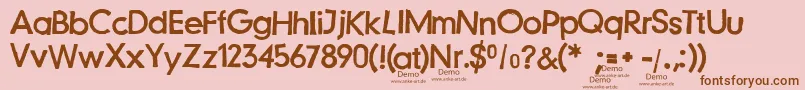 Fonte JustanotherstampfontDemo – fontes marrons em um fundo rosa