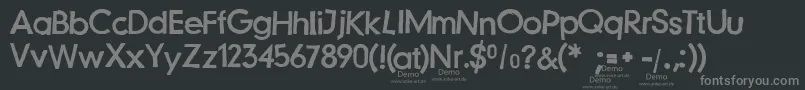 フォントJustanotherstampfontDemo – 黒い背景に灰色の文字