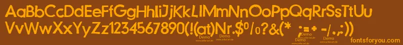 JustanotherstampfontDemo Font – Orange Fonts on Brown Background