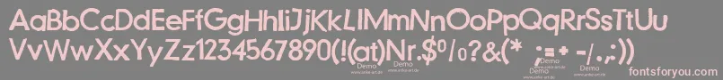 Fonte JustanotherstampfontDemo – fontes rosa em um fundo cinza