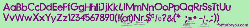 Шрифт JustanotherstampfontDemo – фиолетовые шрифты на зелёном фоне