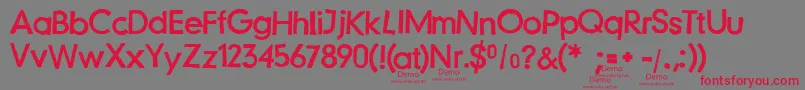 Czcionka JustanotherstampfontDemo – czerwone czcionki na szarym tle