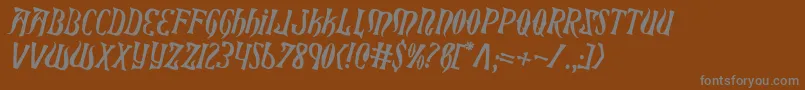 XiphosCounterRotated-fontti – harmaat kirjasimet ruskealla taustalla