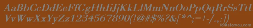 OgilvyBoldItalic-fontti – harmaat kirjasimet ruskealla taustalla