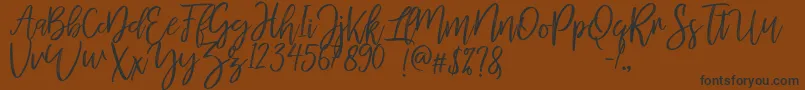 MellonyDryBrush Font – Black Fonts on Brown Background