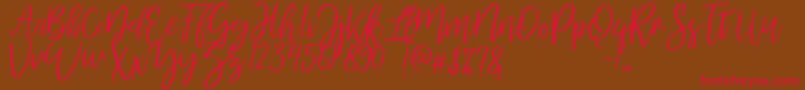 MellonyDryBrush-Schriftart – Rote Schriften auf braunem Hintergrund