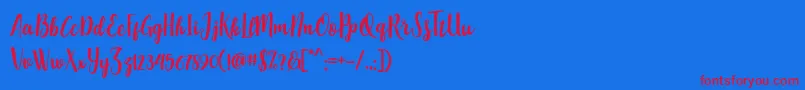 PequeScriptDemo Font – Red Fonts on Blue Background