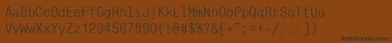 フォントMonocondensedcttRegular – 黒い文字が茶色の背景にあります