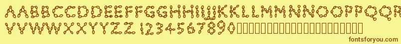 Pwchainsfonts Font – Brown Fonts on Yellow Background