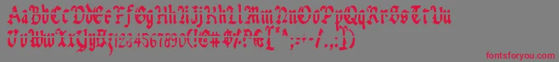 Шрифт UberhГ¶lmeLazarCondensed – красные шрифты на сером фоне