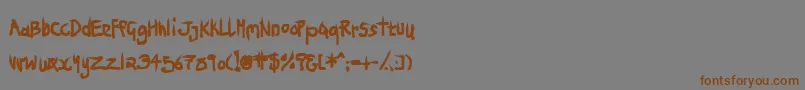 フォントNinjp – 茶色の文字が灰色の背景にあります。