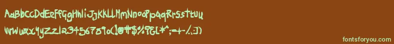 フォントNinjp – 緑色の文字が茶色の背景にあります。