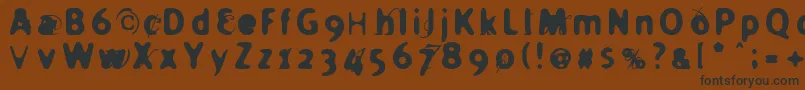 フォントHolier – 黒い文字が茶色の背景にあります