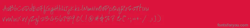Fonte HandscriptleftyItalic – fontes cinzas em um fundo vermelho