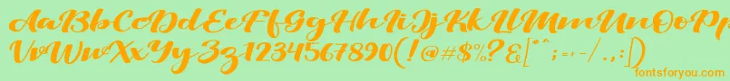 ViksiScript Font – Orange Fonts on Green Background