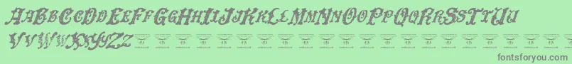 Fonte DinglehuckleberryItalic – fontes cinzas em um fundo verde