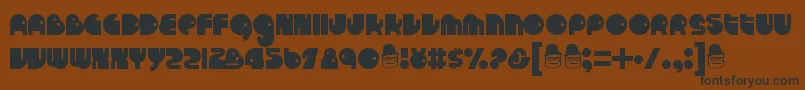 Runtron1983 Font – Black Fonts on Brown Background