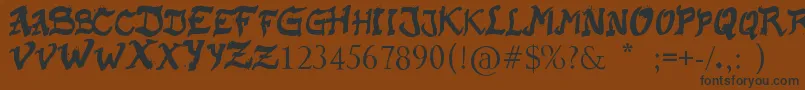 RaslaniKaplash Font – Black Fonts on Brown Background