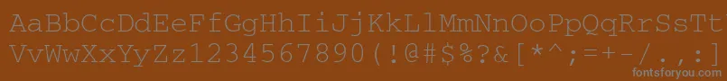 Шрифт Couriermacctt – серые шрифты на коричневом фоне