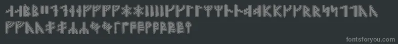 フォントGunnarrunic – 黒い背景に灰色の文字