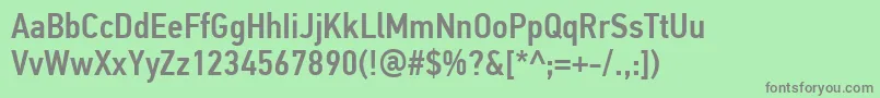 PfdintextcondproMedium-fontti – harmaat kirjasimet vihreällä taustalla