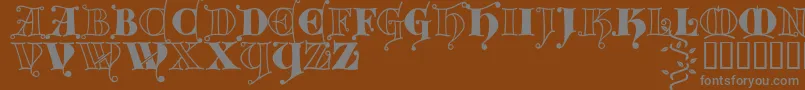 Шрифт Kingthings Versalis – серые шрифты на коричневом фоне