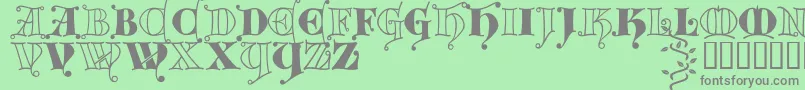 Kingthings Versalis Font – Gray Fonts on Green Background