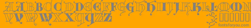 Kingthings Versalis-fontti – harmaat kirjasimet oranssilla taustalla