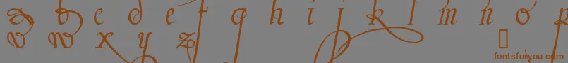 フォントTrinculo – 茶色の文字が灰色の背景にあります。