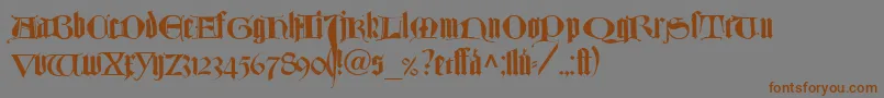 フォントTexturlombardischLtDfr – 茶色の文字が灰色の背景にあります。