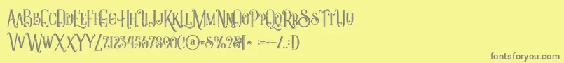 Castileinlinegrunge Font – Gray Fonts on Yellow Background