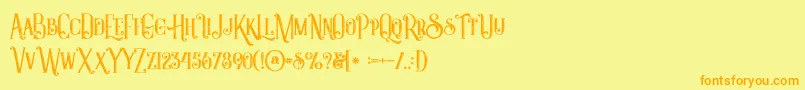 フォントCastileinlinegrunge – オレンジの文字が黄色の背景にあります。