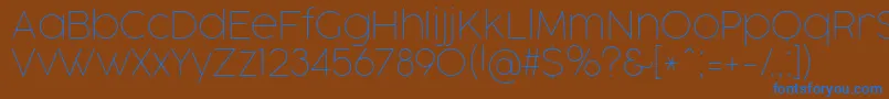 Czcionka CocogooseProThinTrial – niebieskie czcionki na brązowym tle