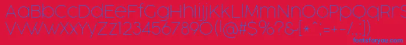 CocogooseProThinTrial-Schriftart – Blaue Schriften auf rotem Hintergrund