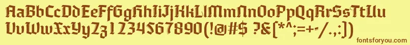 フォントMoyenage – 茶色の文字が黄色の背景にあります。