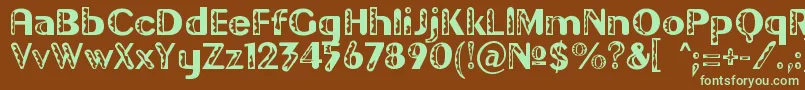 フォントGilgond – 緑色の文字が茶色の背景にあります。