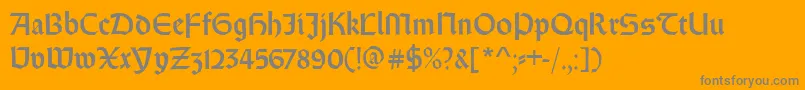 Weissrundgotisch-fontti – harmaat kirjasimet oranssilla taustalla