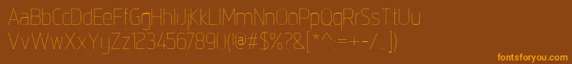 フォントIntropolThin – オレンジ色の文字が茶色の背景にあります。