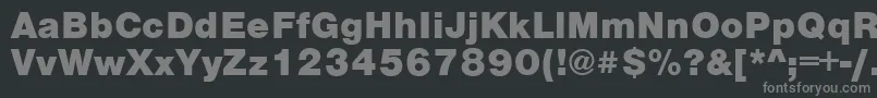 VantaFatPlain-fontti – harmaat kirjasimet mustalla taustalla