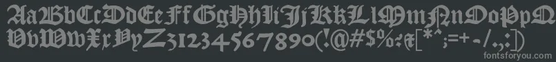 Kjv1611-fontti – harmaat kirjasimet mustalla taustalla