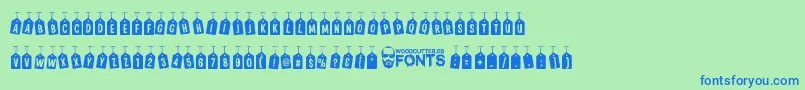 WoodcutterTagsOnARope Font – Blue Fonts on Green Background