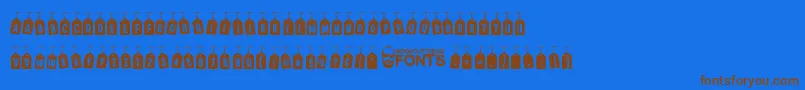 フォントWoodcutterTagsOnARope – 茶色の文字が青い背景にあります。