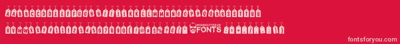 フォントWoodcutterTagsOnARope – 赤い背景にピンクのフォント